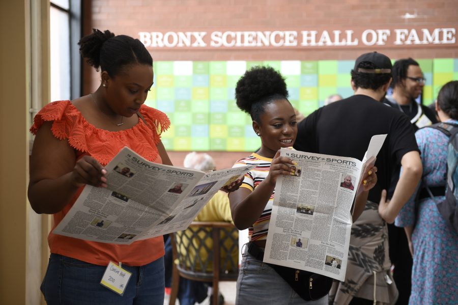 Caroline Holt ’10 and Katherina Brown ’10 read the latest issue of 'The Science Survey' during Alumni Day on June 2nd, 2019.