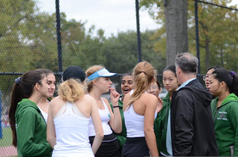 The Tennis Girls' Varsity Team have fun after a game. 