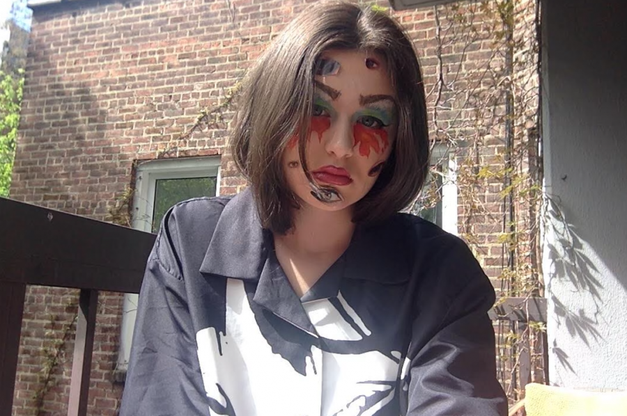 Edie Fine '21 takes her 'artivism' personally, while demonstrating her piece for the 'art rebellion'.