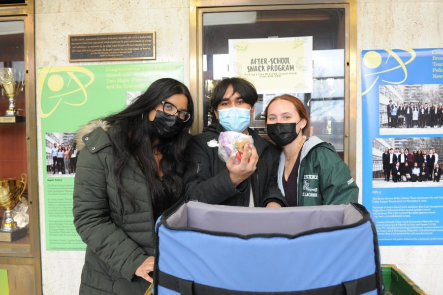  S.O. Chief of Staff Ahona Rana ’22, S.O. Vice President Allision Errico ’22, and S.O. Secretary Sudiptha Paul ’23 work together to hand out after-school snacks to students. 
