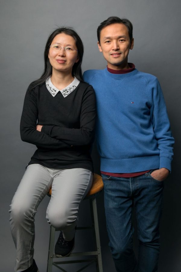 Jie Shan, left, professor of applied and engineering physics in the Cornell College of Engineering, and Kin Fai Mak, assistant professor of physics in the Cornell College of Arts and Sciences, are a married couple of physicists who enjoy collaborating in the lab.