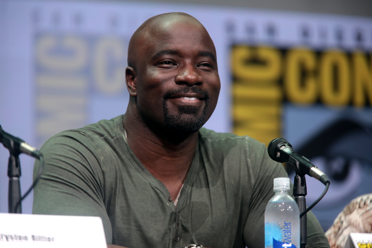 Mike Colter is known for his notable achievements, including his critically acclaimed portrayal of Marvel's Luke Cage, which brought depth and charisma to the iconic character, and his versatile performances in various television series and films, showcasing his remarkable range and talent in the entertainment industry. 
(Photo Credit: Gage Skidmore from Peoria, AZ, United States of America, CC BY-SA 2.0 , via Wikimedia Commons)