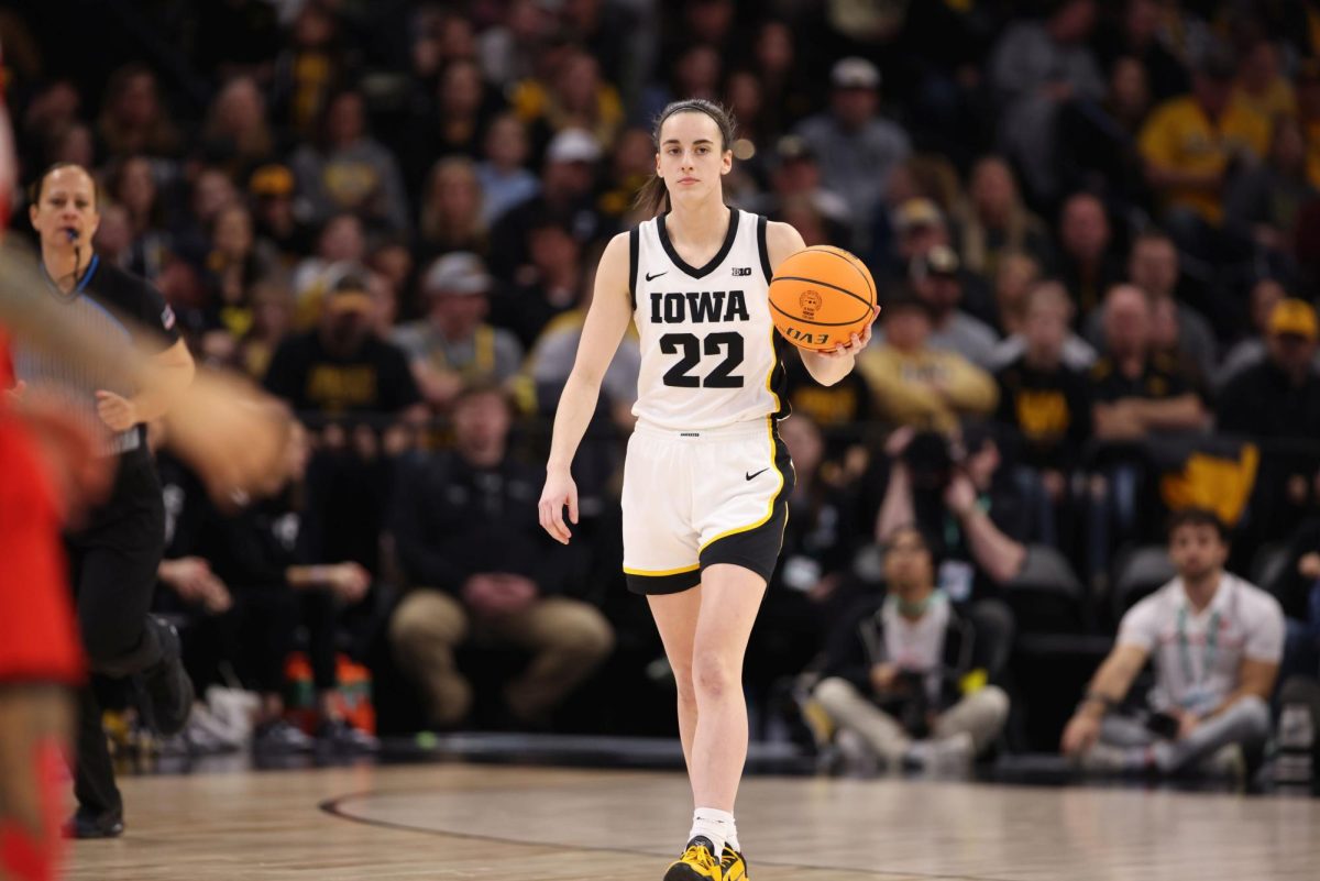Here is Caitlin Clark during an Iowa versus Ohio Championship game. (Photo Credit: John Mac, CC BY-SA 2.0 , via Wikimedia Commons)