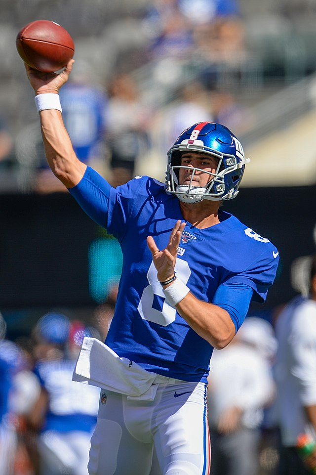 Here, Daniel Jones attempts a throw during his 2019 rookie campaign. (Photo Credit: All-Pro Reels, CC BY-SA 2.0 , via Wikimedia Commons)
