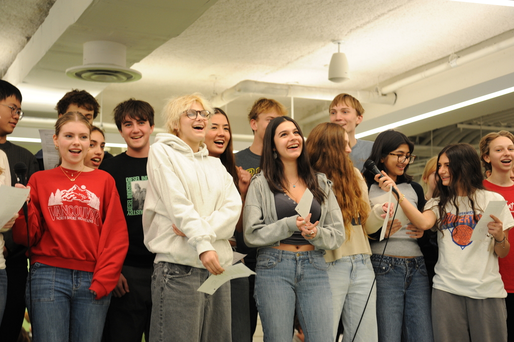 Students in A.P. French sing along to a French song, enjoying the performance.