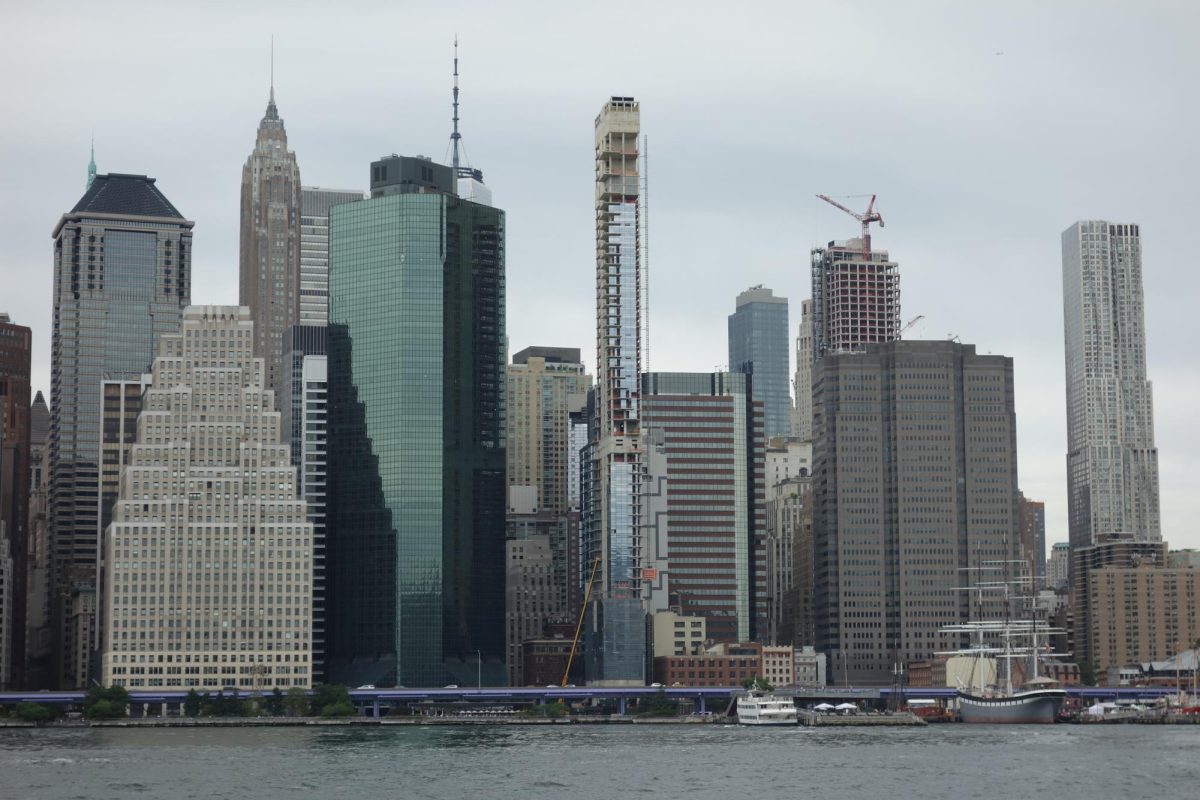 In the center of this cityscape sits a high rise called Seaport Residences, a skyscraper left unfinished for years in Manhattan due to a 3 inch lean. (Photo Credit: Tdorante10, CC BY-SA 4.0 , via Wikimedia Commons)