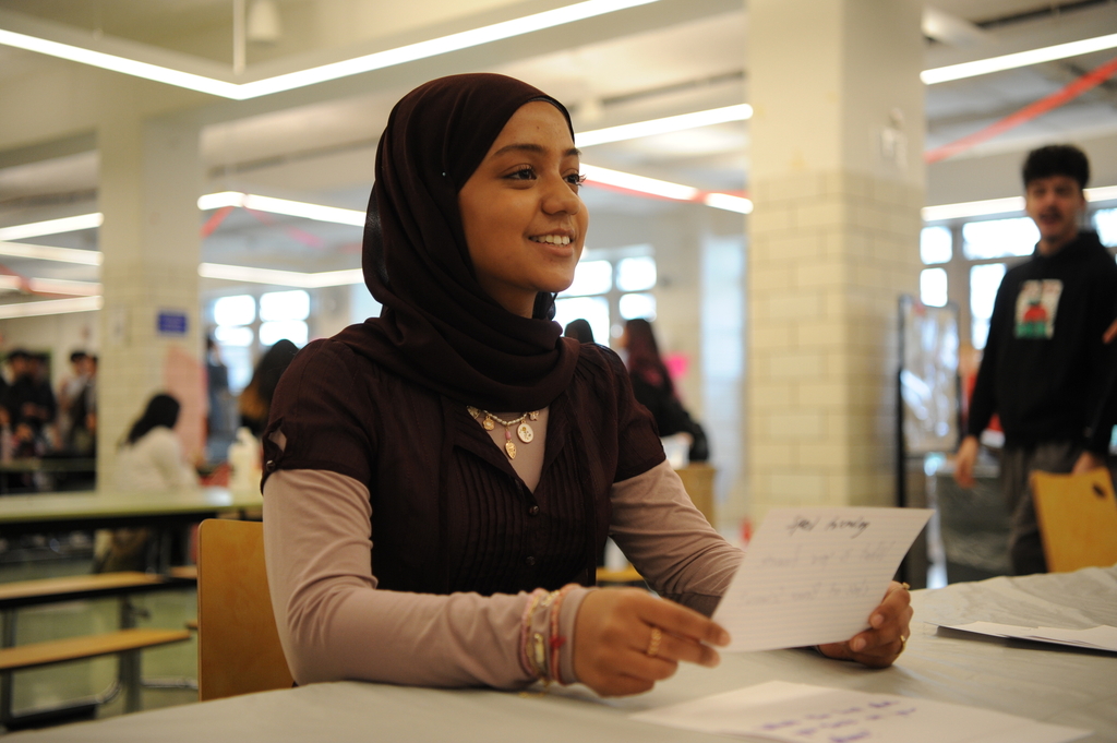 A student receives her letter with a smile.